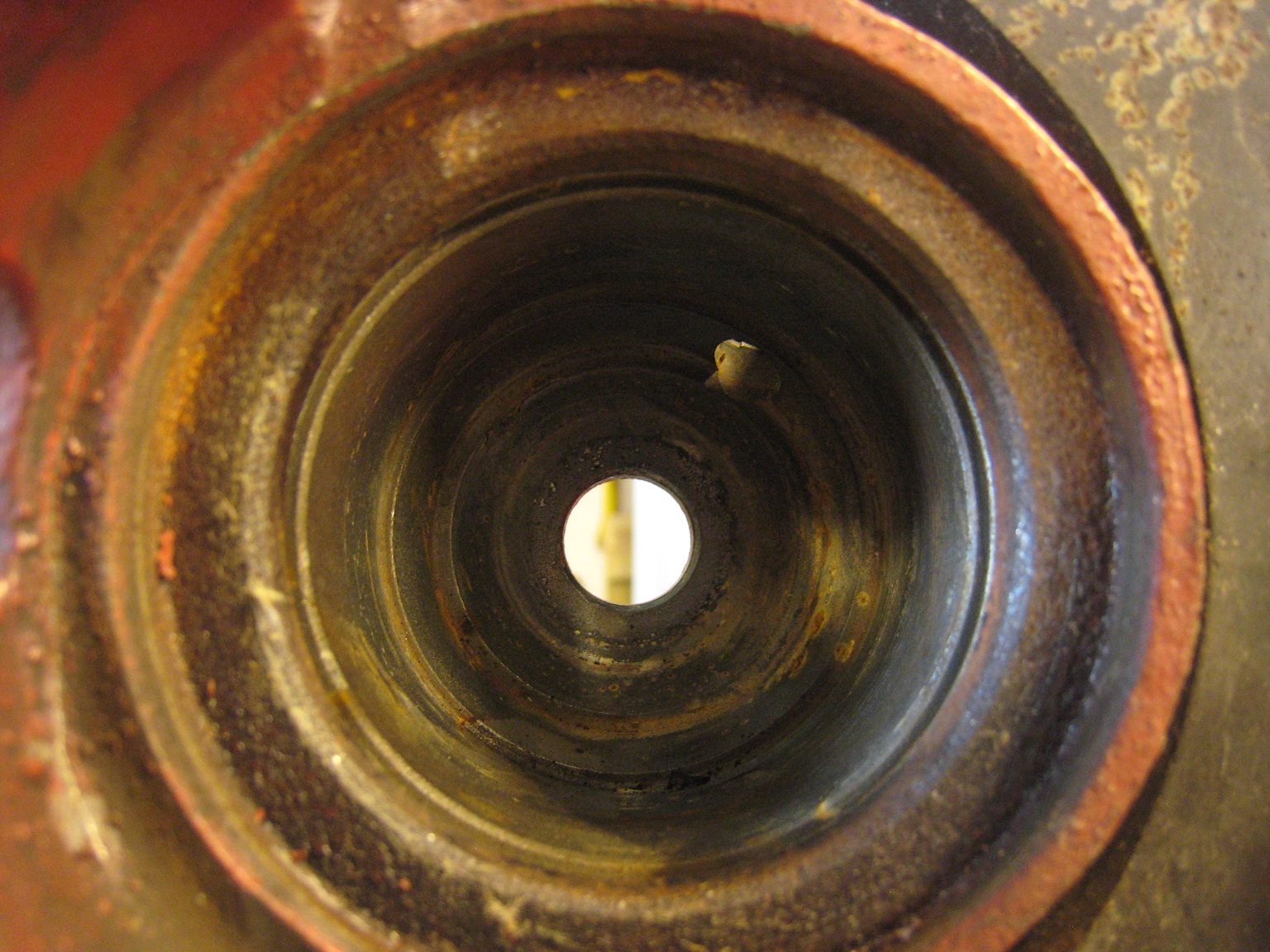 Modify upsidedown Cadillac Seville rear calipers for easier bleeding